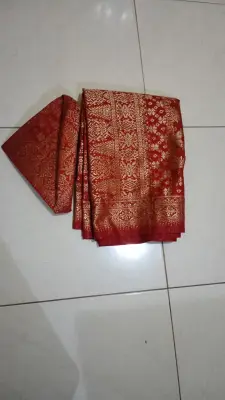 Topi dan kain Palembang